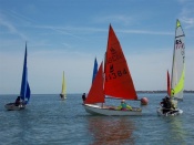 Dinghy sailors enjoying annual regatta.
